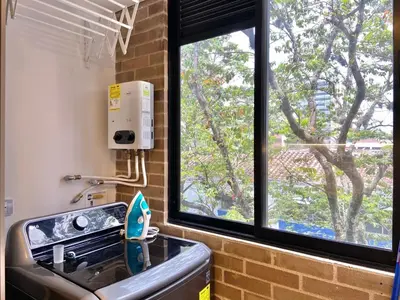 a kitchen with a sink and a window at Ganesh by Wynwood House in Medellín