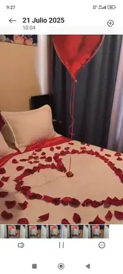 a bed with a red balloon on top of it at Apartamento cerca a Medellín - Puerta del norte Bello in Machado