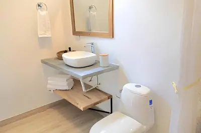 a bathroom with a sink and a toilet at Mágica CASA FINCA de lujo piscina privada wi-fi tv in Mariquita