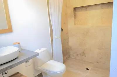 a bathroom with a toilet and a shower at Mágica CASA FINCA de lujo piscina privada wi-fi tv in Mariquita