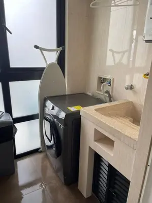 a washing machine in a bathroom with a sink at 1103 The Overlook of Medellin in El Poblado in Medellín