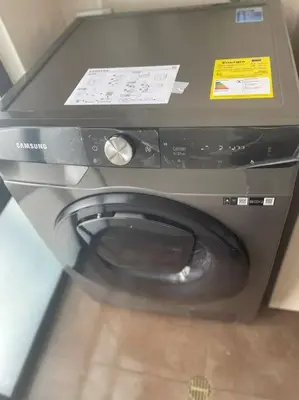 a washing machine with a toilet in a room at 1103 The Overlook of Medellin in El Poblado in Medellín