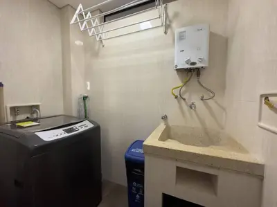 a laundry room with a sink and a washing machine at 1201 Luxury Excelente ubicación in Medellín