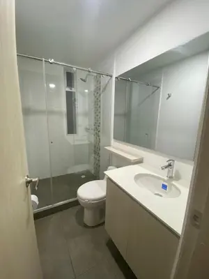 a bathroom with a toilet and a sink and a shower at BALMORAL in Manizales