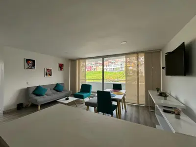a living room with a couch and a table at BALMORAL in Manizales