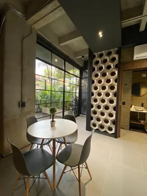 a dining room with a table and chairs at Recinto68 in Medellín