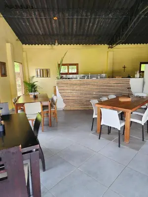a restaurant with tables and chairs and a bar at Eco hotel Torino in Tarso
