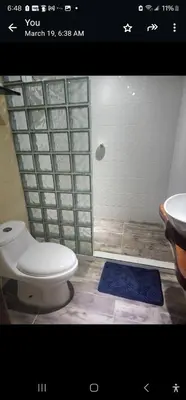 a bathroom with a toilet and a shower with a sink at Eco hotel Torino in Tarso