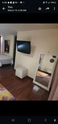 a picture of a room with a mirror and a bed at Eco hotel Torino in Tarso