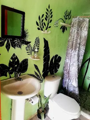 a bathroom with a sink and a toilet at Hospedaje Pa'Gaïa in San Rafael
