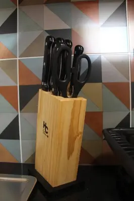 a knife block with scissors in it next to a sink at Nueva Tiny House en el Poblado FRN110 By Roots Rentals in Medellín