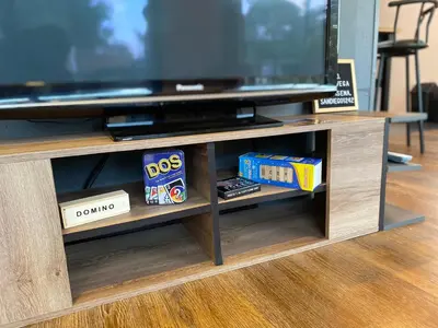 a entertainment center with a flat screen tv and dvd players at Casa campestre descanso relajación jacuzzi BBQ amplias zonas verdes in Carmen de Viboral