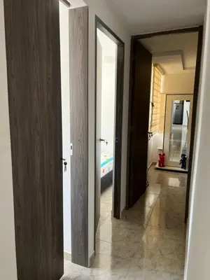 a hallway with two open doors and a hallway with a hallway at Apartamento Nogales in Bello