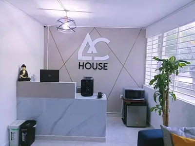 a room with a house sign on the wall at AC - House Laureles - Self Cheking in Medellín
