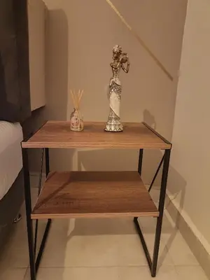 a wooden table with a vase on top of it at AC - House Laureles - Self Cheking in Medellín