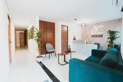 a living room with a blue couch in a house at AC - House Laureles - Self Cheking in Medellín