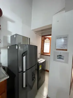 a kitchen with a stainless steel refrigerator in a kitchen at Apartamento 501 in Itagüí