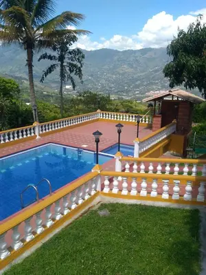 a swimming pool with a fence around it at Villa Yolanda in Girardota
