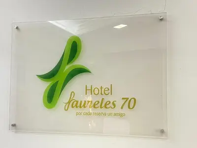 a sign for a hotel jaleeples for each person at Hotel Laureles 70 Medellín in Medellín