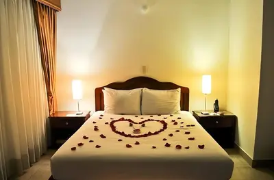 a bedroom with a bed with a heart drawn on it at Hotel Laureles 70 Medellín in Medellín