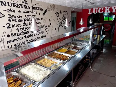 a buffet line with many different types of food at Hotel boutique San Pablo H3 in Medellín