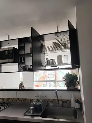 a kitchen with a sink and a window in it at En la cima y en el corazón de Medellín in Medellín