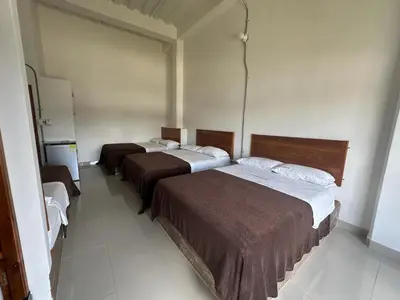 a room with two beds in a room at LA PLAZOLETA in Doradal