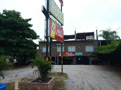 a sign for a hotel in front of a building at LA PLAZOLETA in Doradal