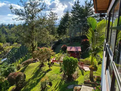 a view of a garden from a house at Desconéctate! Casa de campo con vista sensacional !!! in Rionegro
