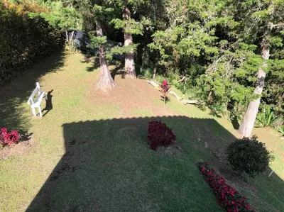 an aerial view of a park with a bench in the grass at Desconéctate! Casa de campo con vista sensacional !!! in Rionegro