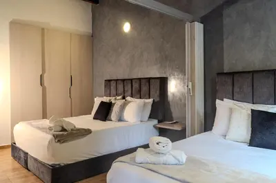 two beds in a hotel room with two beds sidx sidx sidx at 203 Enigmatic Loft with Jacuzzi in Medellín