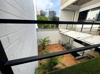 a view of a balcony of a building at Económicas habitaciones amobladas en Medellín con oficinas, puesto de trabajo, cocina, baño y lavandería comunes Be Together by Roots Rentals TOG401y402 in Medellín