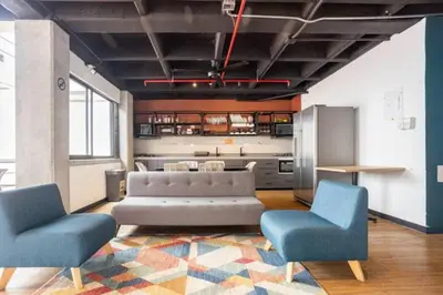a living room with a couch and two chairs at Económicas habitaciones amobladas en Medellín con oficinas, puesto de trabajo, cocina, baño y lavandería comunes Be Together by Roots Rentals TOG401y402 in Medellín