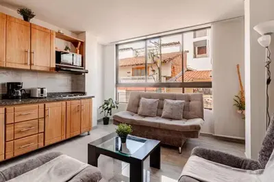 a living room with a couch and a table at Apartamento centro Marinilla in Marinilla