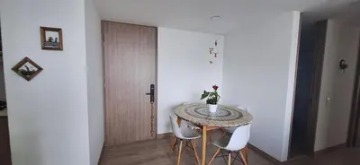 a dining room with a table and two chairs at Hermoso Apartamento exclusiva ubicación in Manizales
