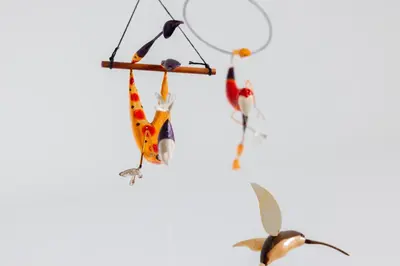 a group of three birds hanging on a branch at Hermoso Apartamento exclusiva ubicación in Manizales
