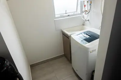 a small bathroom with a sink and a window at Hermoso Apartamento exclusiva ubicación in Manizales