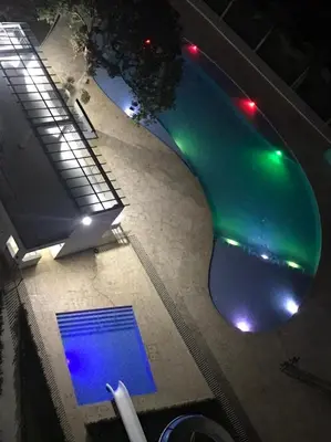 an overhead view of a swimming pool at night at Disole 504 in Santa Fe de Antioquia