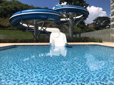 a pool with a water slide in the middle at Disole 504 in Santa Fe de Antioquia