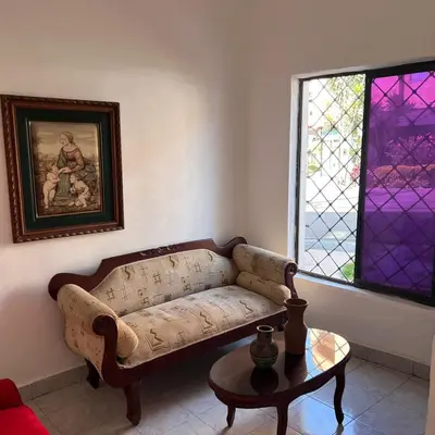 a living room with a couch and a table at Casa Familiar- Turística Manríque Medellín in Medellín