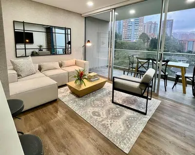 a living room with a couch and a table at Great view apartment in El Poblado in Medellín