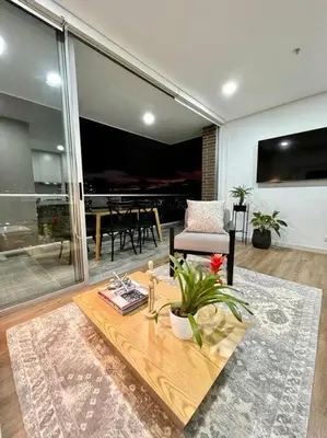 a living room with a couch and a table at Great view apartment in El Poblado in Medellín