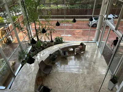 an overhead view of a person sitting in a chair in a lobby at Great view apartment in El Poblado in Medellín