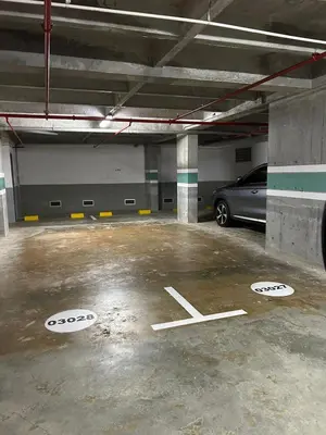 a parking garage with a car parked in it at Great view apartment in El Poblado in Medellín