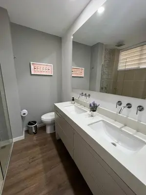 a bathroom with two sinks and a toilet at Great view apartment in El Poblado in Medellín