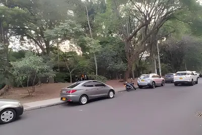 a group of cars parked in a parking lot at Acogedor Loft en la floresta cerca al metro in Medellín