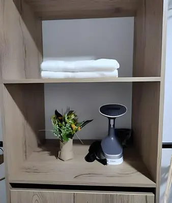 a shelf with a vase with a plant in it at Acogedor Loft en la floresta cerca al metro in Medellín