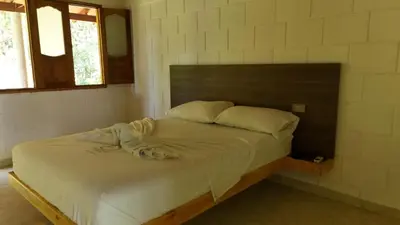 a bedroom with a bed in a room at HOTEL CAMPESTRE LAS CAVERNAS in Mesa del Norte