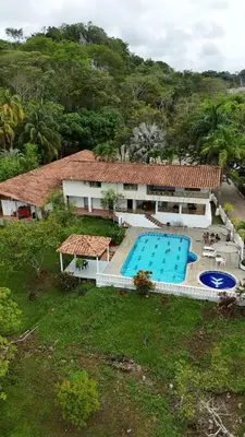 an aerial view of a house with a swimming pool at HOTEL CAMPESTRE LAS CAVERNAS in Mesa del Norte