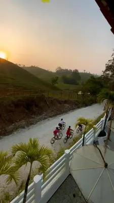 a group of people riding bikes down a dirt road at HOTEL CAMPESTRE LAS CAVERNAS in Mesa del Norte